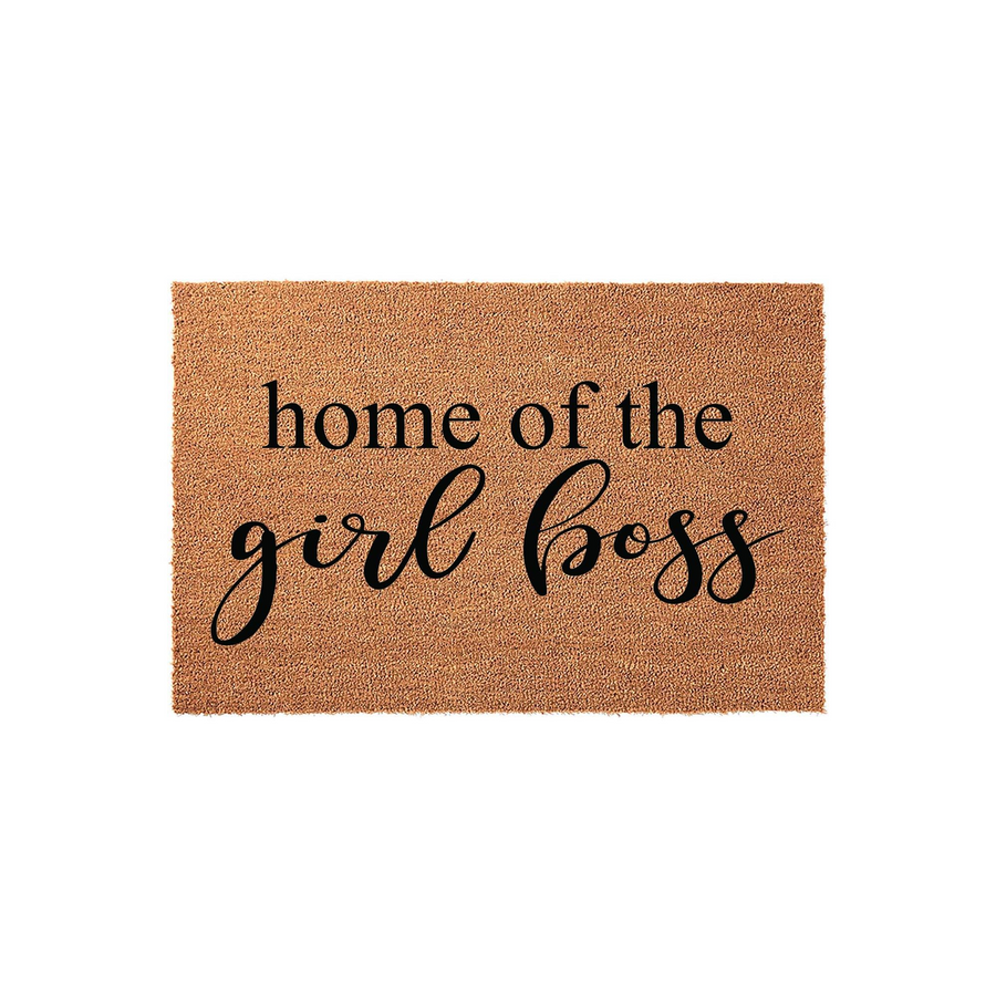 Home of the Girl Boss coir doormat featuring a natural tan fiber texture and bold black lettering, providing a stylish and welcoming entrance for any home office or front porch area that celebrates female entrepreneurship and