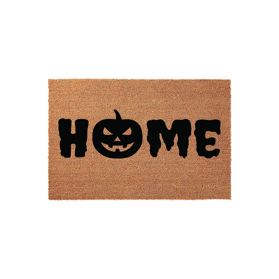 Halloween Home Doormat featuring a natural coir fiber texture with a bold black design that spells out the word home, using a spooky jack-o-lantern pumpkin to replace the letter o for a festive fall porch decor look on a white