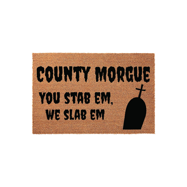 County Morgue Halloween Doormat featuring a spooky tombstone graphic and the humorous text You Stab Em We Slab Em printed in black on a natural coir fiber mat, perfect for a scary front porch entryway during the fall holiday