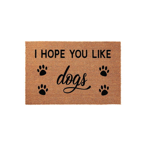 I Hope You Like Dogs coir doormat featuring a natural tan fiber texture with black printed text and four paw prints, creating a fun and welcoming entryway decor piece for any dog lover who wants to greet their guests with a