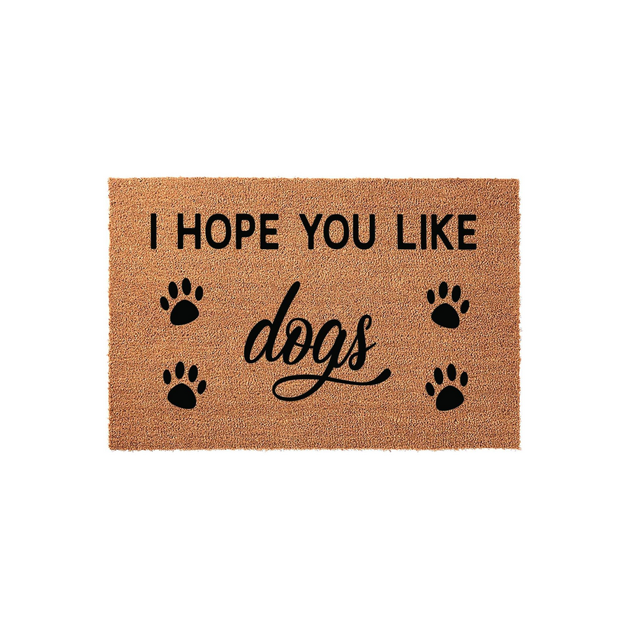 I Hope You Like Dogs coir doormat featuring a natural tan fiber texture with black printed text and four paw prints, creating a fun and welcoming entryway decor piece for any dog lover who wants to greet their guests with a