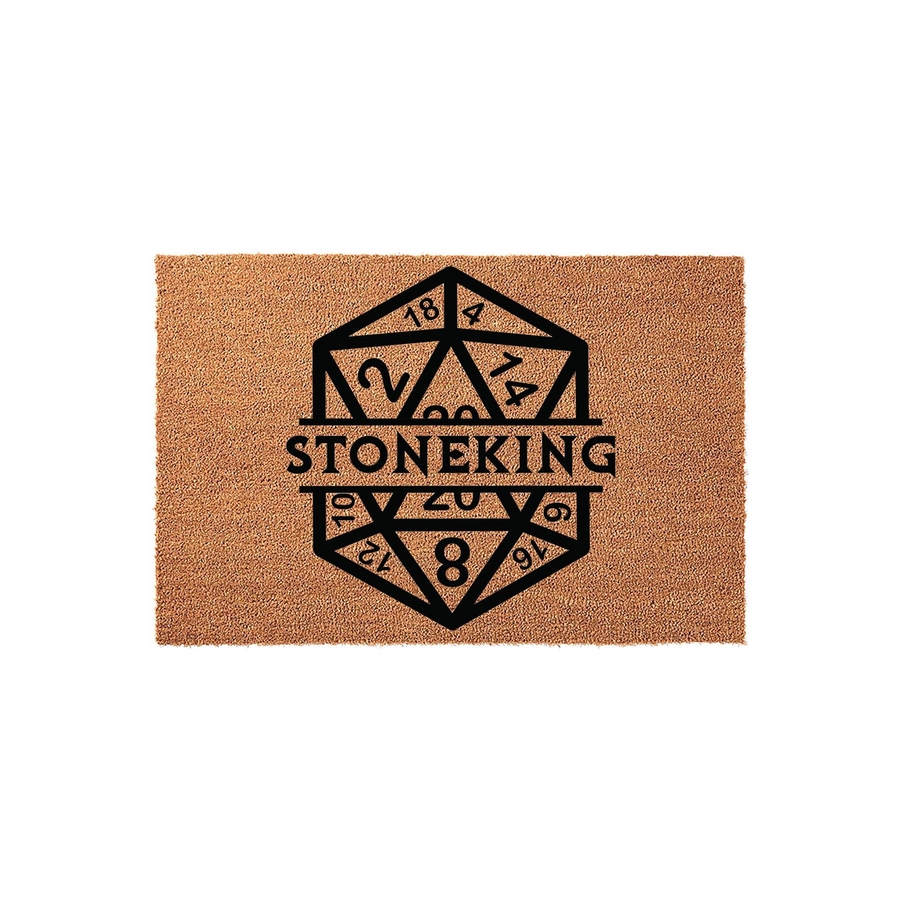Personalized D20 Dice Doormat featuring a large black graphic of a twenty-sided die with the custom family name Stoneking printed across the center, set against a natural brown coir fiber background for a unique tabletop gaming