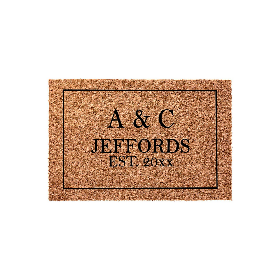 Personalized Family Name Coir Doormat featuring a classic black border and custom text that includes initials, a last name, and an established year, presented on a natural tan textured coir fiber background for a welcoming home