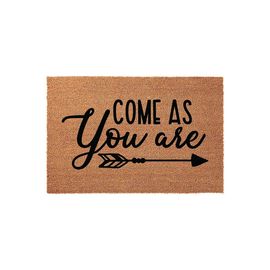 Come As You Are coir doormat featuring a natural brown fiber texture and bold black lettering with a decorative arrow graphic, providing a welcoming and rustic touch to your front porch entryway decor on a clean white background.