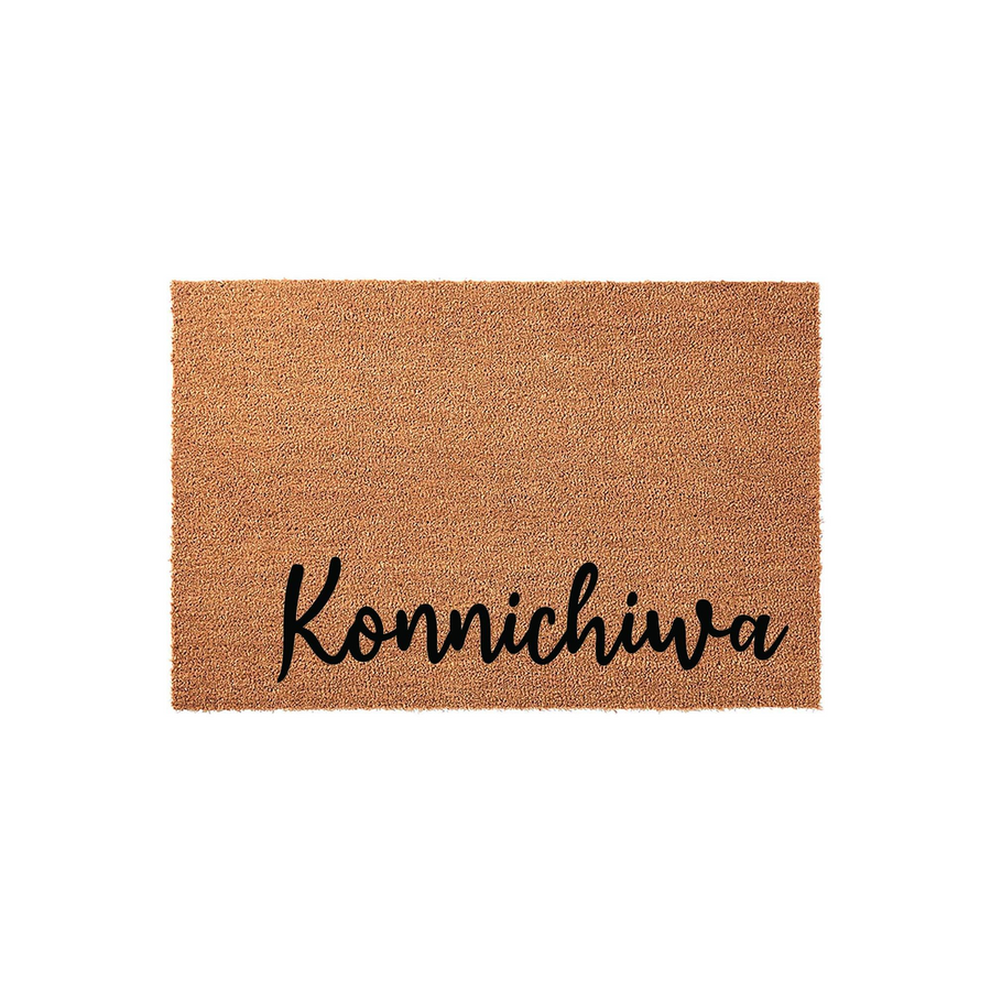 Konnichiwa coir doormat featuring a natural brown fiber texture and elegant black script lettering, designed as a welcoming front porch entrance mat for your home that adds a touch of Japanese-inspired style to any entryway.