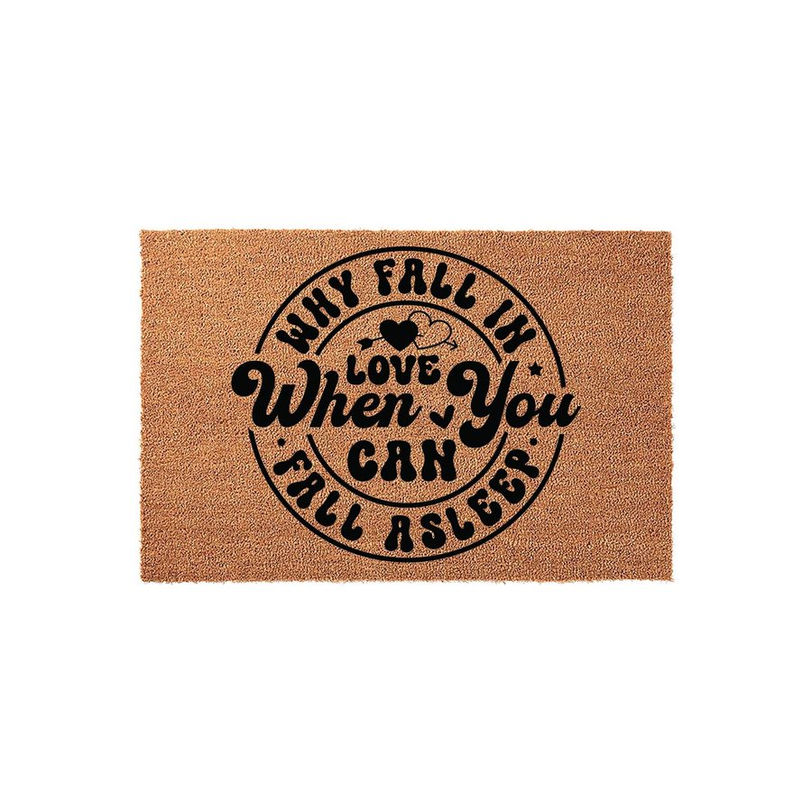 Why Fall In Love When You Can Fall Asleep coir doormat featuring bold black typography and a heart icon, presented on a clean white background for a humorous and cozy entryway decor statement that welcomes guests with a funny