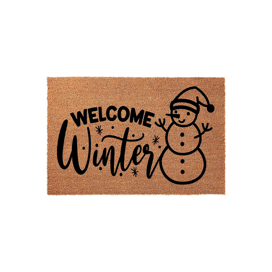 Welcome Winter snowman doormat made of natural coir fiber, featuring a festive black graphic of a smiling snowman wearing a hat and snowflakes, perfect for adding a cozy seasonal touch to your front porch entryway decor this