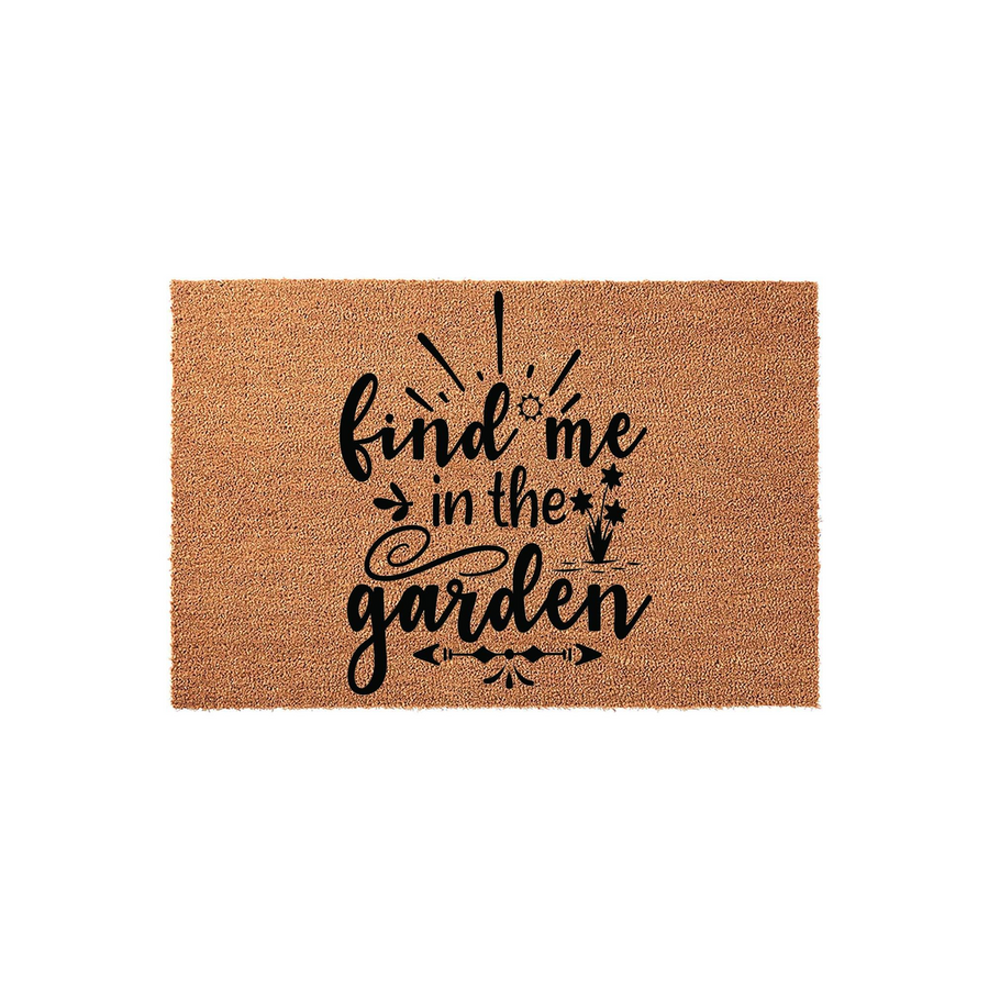 Find Me In The Garden coir doormat featuring a natural tan fiber texture and bold black typography, designed with whimsical plant-themed accents and decorative arrows to welcome guests to your outdoor home entryway or patio space.