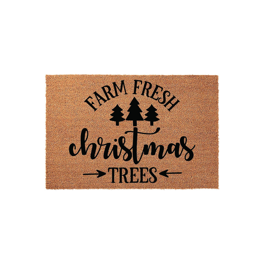 Farm Fresh Christmas Trees coir doormat featuring a rustic tan natural fiber texture with black printed holiday typography and three pine tree icons, creating a festive seasonal welcome for your front porch entryway decor.