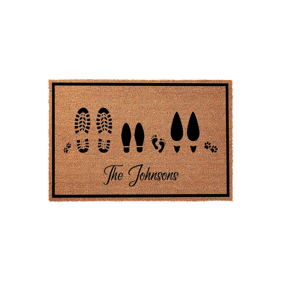 Personalized family doormat featuring a natural coir texture with black printed footprints of adults, children, and pet paws, centered with a custom family name in elegant script on a clean white background for a welcoming home