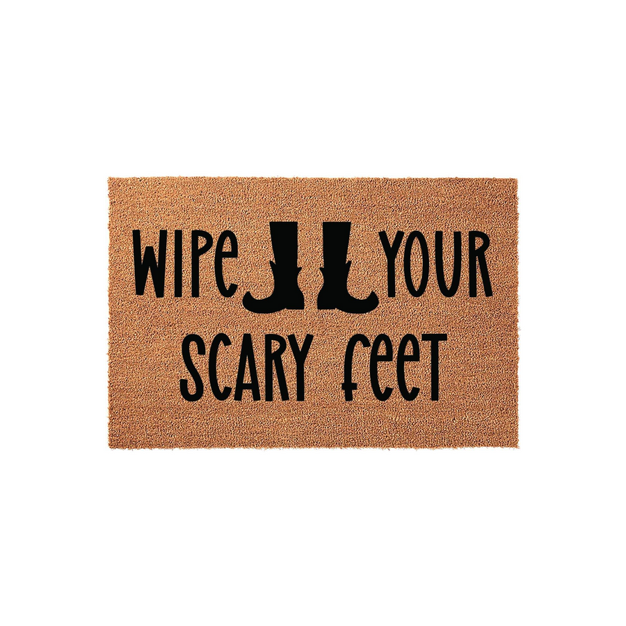 Funny Halloween doormat made of natural coir fiber featuring the text Wipe Your Scary Feet with black witch boot silhouettes, displayed on a clean white background for a festive seasonal entryway decoration that welcomes guests.