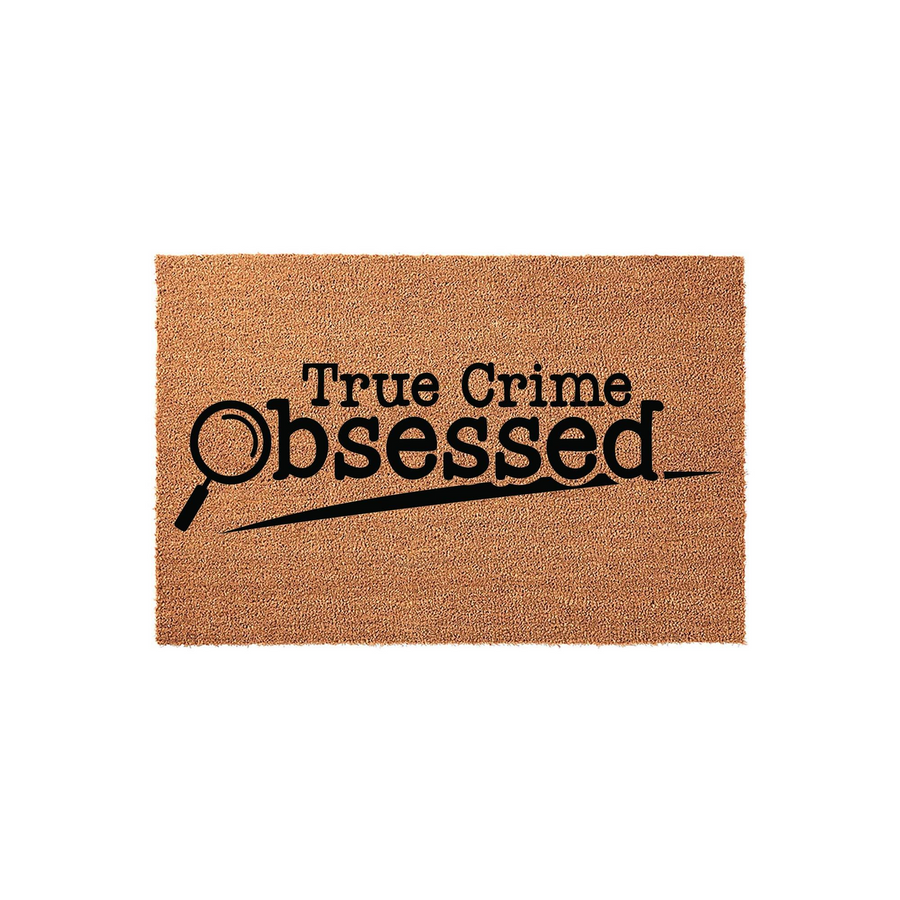 True Crime Obsessed coir doormat featuring a natural brown fiber texture and bold black text with a magnifying glass graphic, making it a fun front porch decor choice for fans of mystery and true crime podcasts and documentaries.