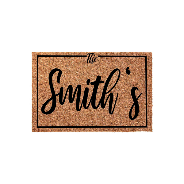Personalized family name coir doormat featuring a classic rectangular border and elegant black script text that reads The Smith's, providing a welcoming and durable entrance floor mat for any home front porch or entryway decor.