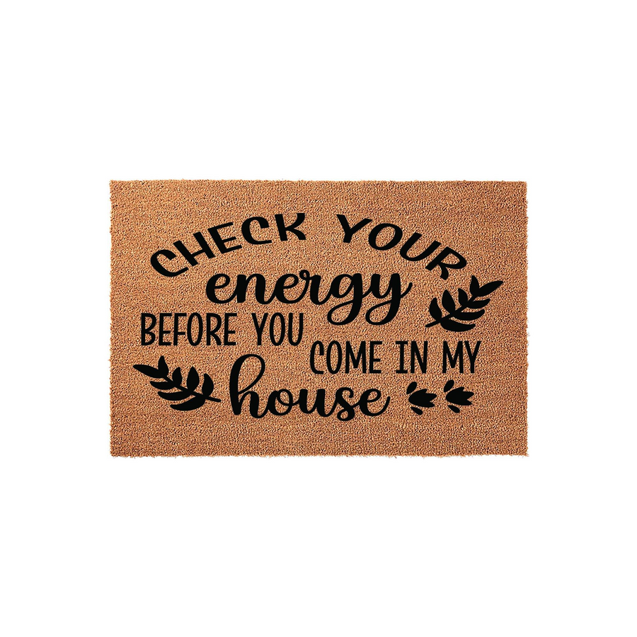 Check Your Energy Before You Come In My House doormat featuring bold black typography and decorative leaf accents on a natural tan coir fiber background, creating a funny and welcoming entryway decor piece for your front porch.