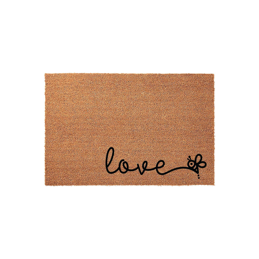 Love Bee Coir Doormat featuring a natural tan fiber texture with the word love written in black cursive script, where the letter e is creatively stylized as a cute bumblebee, set against a clean white studio background for a