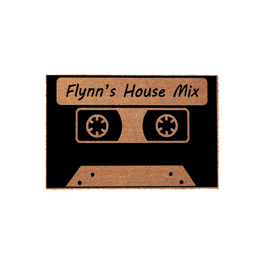 Personalized Cassette Tape Doormat featuring a retro music design on a natural coir fiber mat, with custom text printed in a bold black font against the textured tan background for a nostalgic home entrance decor piece.