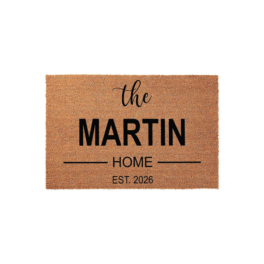 Personalized family name coir doormat featuring a natural tan fiber texture with black text that reads the family name followed by home and an established year, creating a welcoming entrance for any front porch or house entryway.