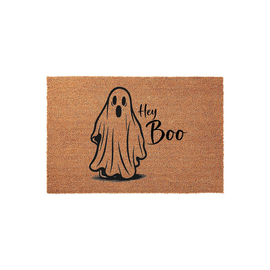 Hey Boo Halloween doormat made of natural coir fiber, featuring a cute black line-art ghost illustration and playful script text centered on a rectangular brown mat for a festive seasonal entryway decoration.