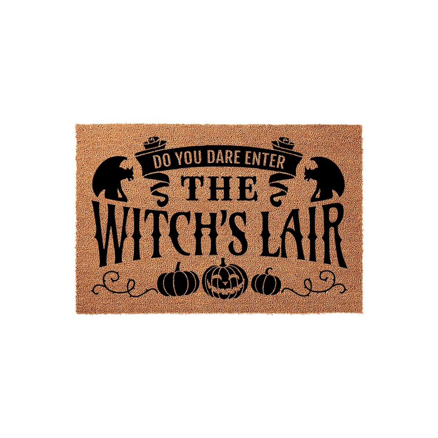 Witch's Lair Halloween doormat featuring a natural coir texture with black printed text that reads Do You Dare Enter The Witch's Lair, accented by silhouettes of cats, pumpkins, and decorative swirls on a plain white background.