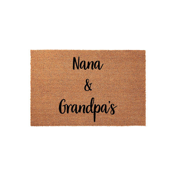 Nana and Grandpa's personalized coir doormat features a natural tan fiber texture with elegant black script lettering, creating a warm and welcoming entrance for a grandparent's home on a clean, solid white studio background.