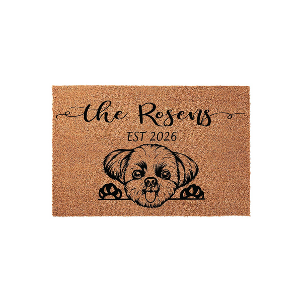 Personalized Shih Tzu doormat featuring a cute illustrated dog peeking over the bottom edge, printed on a natural coir fiber mat with custom family name text and established year details for a welcoming front porch entrance decor.
