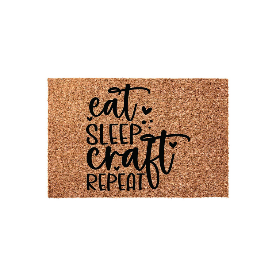 Eat Sleep Craft Repeat coir doormat featuring a natural brown fiber texture and bold black lettering, designed for a craft room entrance or a creative home workspace to showcase a love for DIY projects and handmade hobbies.