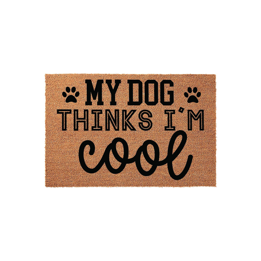 My Dog Thinks I Am Cool coir doormat featuring bold black text and paw print accents on a natural tan fiber background, making it a fun and durable outdoor welcome mat for any pet lover looking to add personality to their front