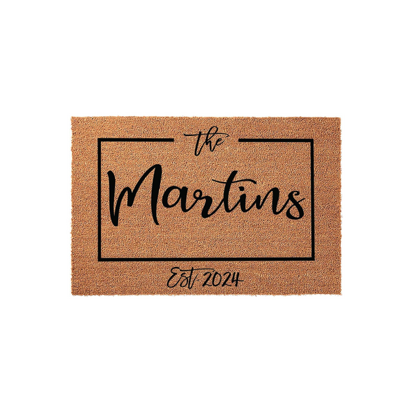 Personalized family name coir doormat featuring a clean rectangular border design with elegant black script text, providing a welcoming entrance piece for a home that highlights the established year on a natural tan fiber