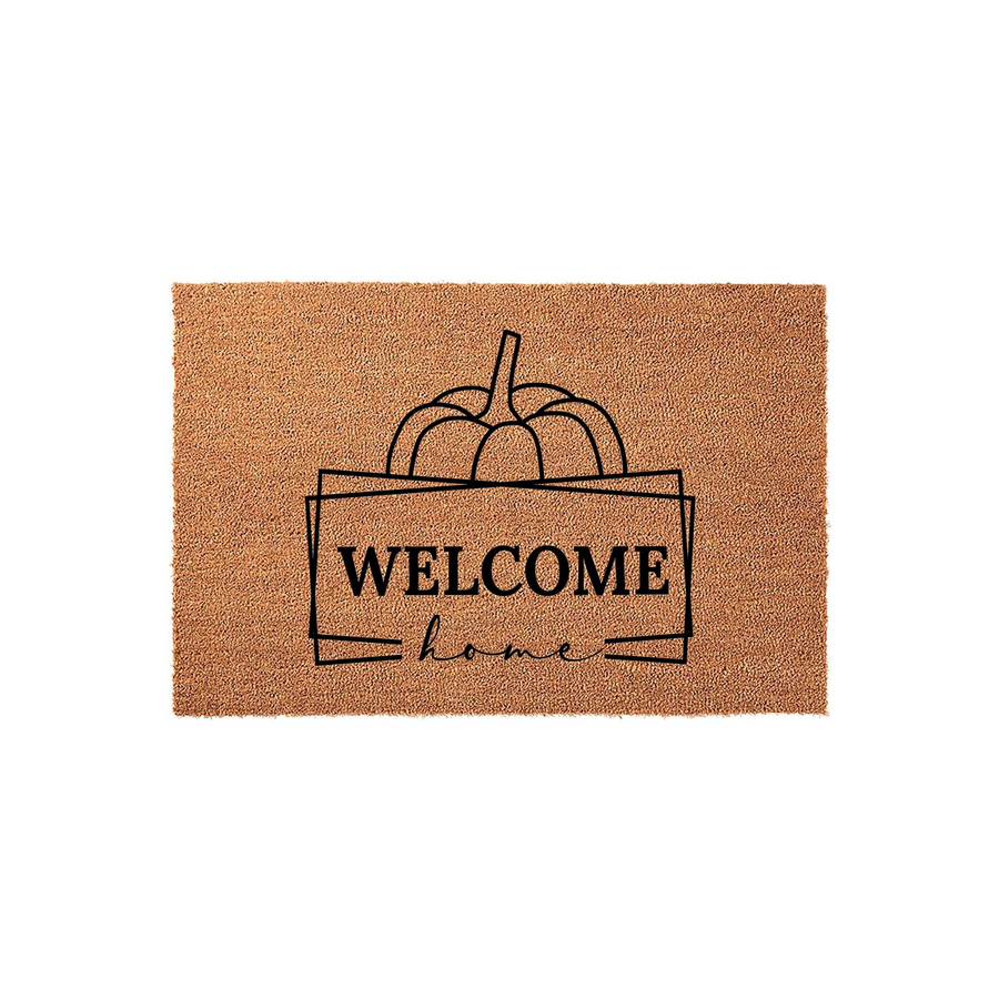 Fall Pumpkin Welcome Home Doormat featuring a natural coir texture with a black line-art pumpkin graphic and modern typography, creating a cozy seasonal entryway decor piece for your front porch during the autumn harvest season.