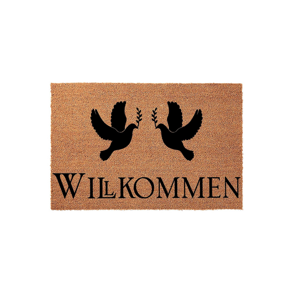 Wilkommen Dove Welcome Doormat made of natural coir fiber, featuring two black silhouettes of flying doves carrying olive branches above the German word for welcome, set against a plain white studio background for a clean