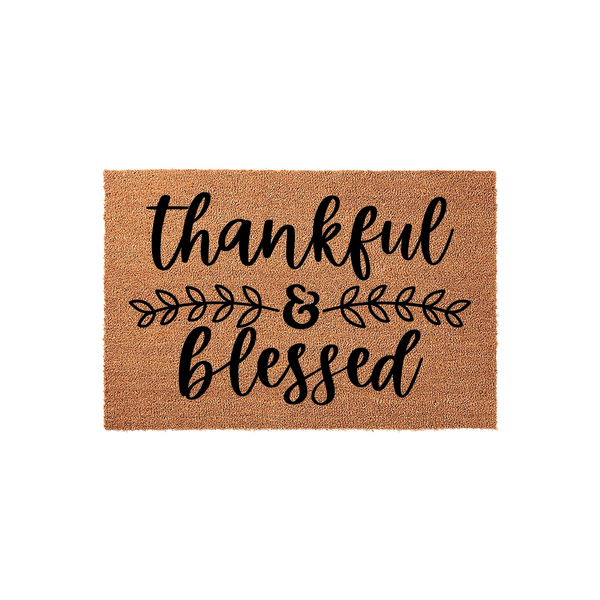 Thankful and Blessed coir doormat featuring a natural brown fiber texture with black script lettering and a decorative leaf branch design in the center, creating a welcoming farmhouse style entrance for your front porch decor.