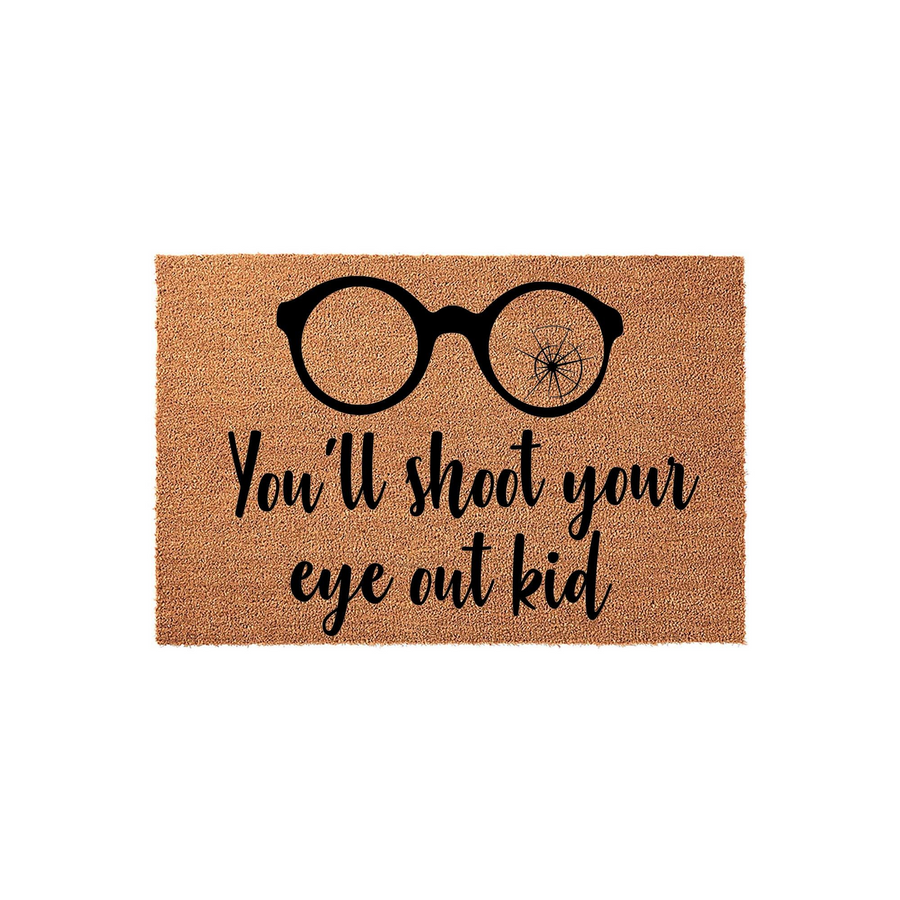 Christmas Movie Quote Doormat featuring a pair of black glasses with one cracked lens and the text You'll shoot your eye out kid, printed on a natural brown coir fiber mat against a clean white background for a festive holiday