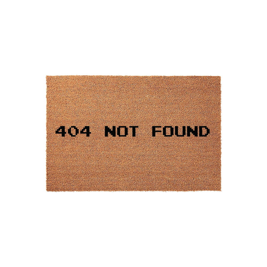 404 Not Found Doormat featuring a humorous computer error message printed in bold black pixelated font on a natural brown coir fiber mat, displayed against a clean white background for a modern tech-inspired home entryway decor.