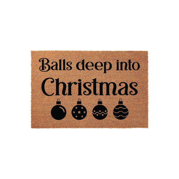 Funny Christmas doormat featuring the text Balls deep into Christmas in bold black lettering, accompanied by four decorative holiday ornament icons on a natural brown coir fiber background for a festive seasonal home entryway
