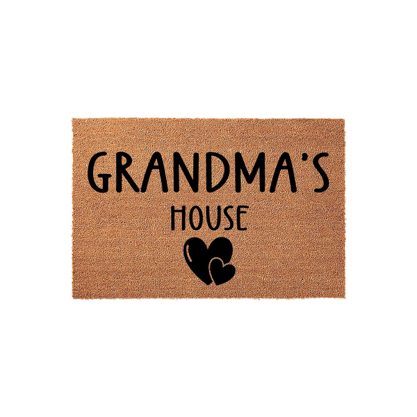 Grandma's House coir doormat featuring a natural tan fiber texture with bold black lettering and two simple heart icons, creating a welcoming entryway decor piece for a grandparent's home on a clean white background.