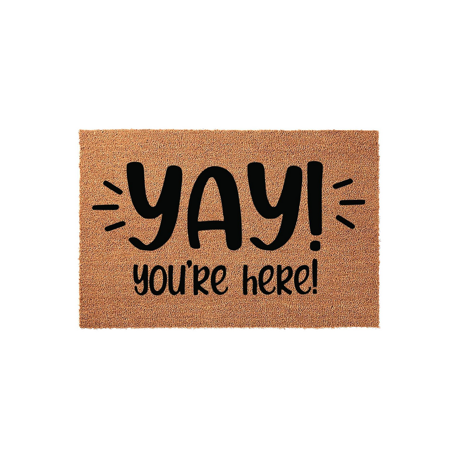 Yay You're Here coir doormat featuring a natural brown fiber texture and bold black lettering that greets guests at your front door with a fun and cheerful message, making it a welcoming addition to any home entryway or porch