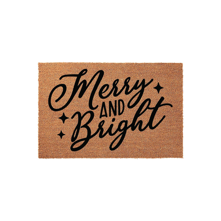 Merry and Bright Christmas doormat made of natural coir fiber with a rectangular shape, featuring elegant black script lettering and small star accents centered on a plain white background for holiday home decor.