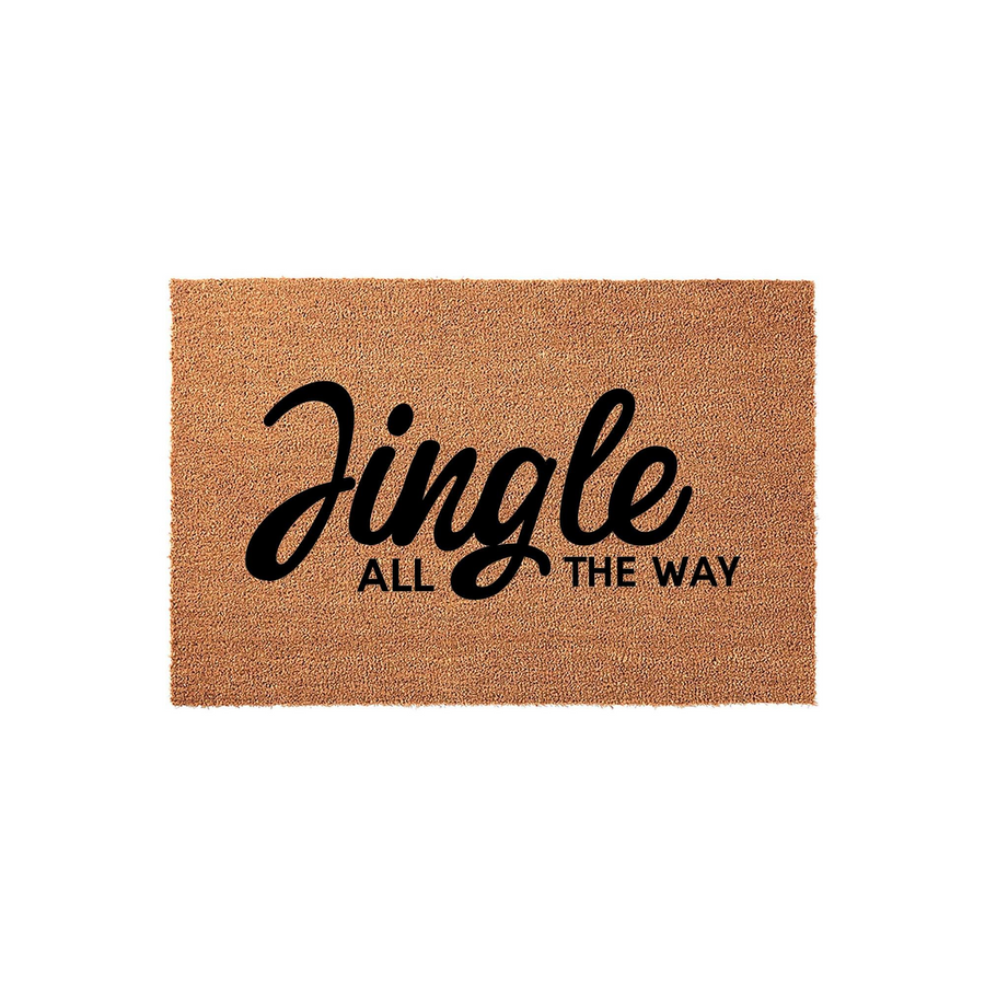 Jingle All The Way Christmas Doormat made of natural coir fiber with a rectangular shape, featuring bold black script and sans-serif lettering centered on the textured brown surface for a festive holiday entryway decoration.