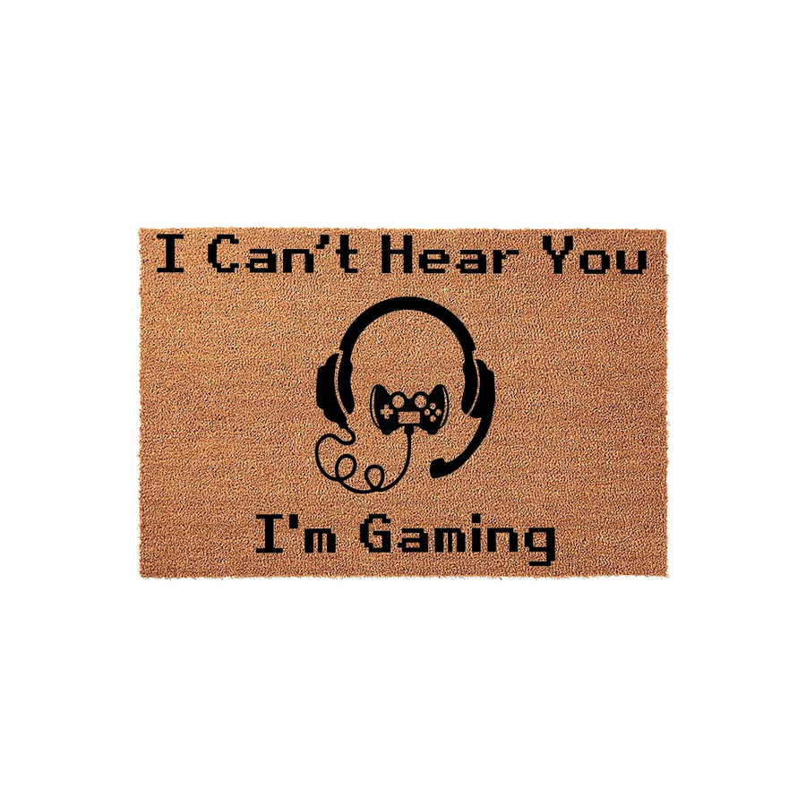 I Can't Hear You I'm Gaming doormat featuring a natural coir texture with a black graphic of a video game controller and headset, making it a fun front porch decor piece for any gamer who loves playing video games in their home.