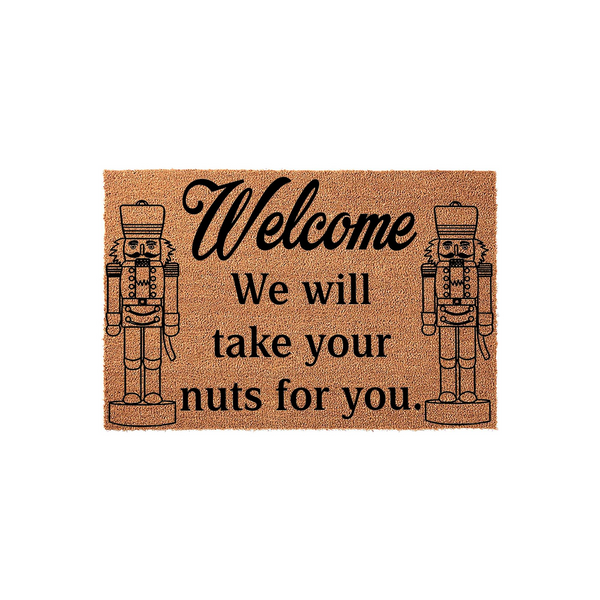 Nutcracker Welcome Doormat featuring a natural coir texture with two black printed nutcracker figures flanking the humorous text that reads Welcome We will take your nuts for you, creating a festive holiday entryway decor piece.