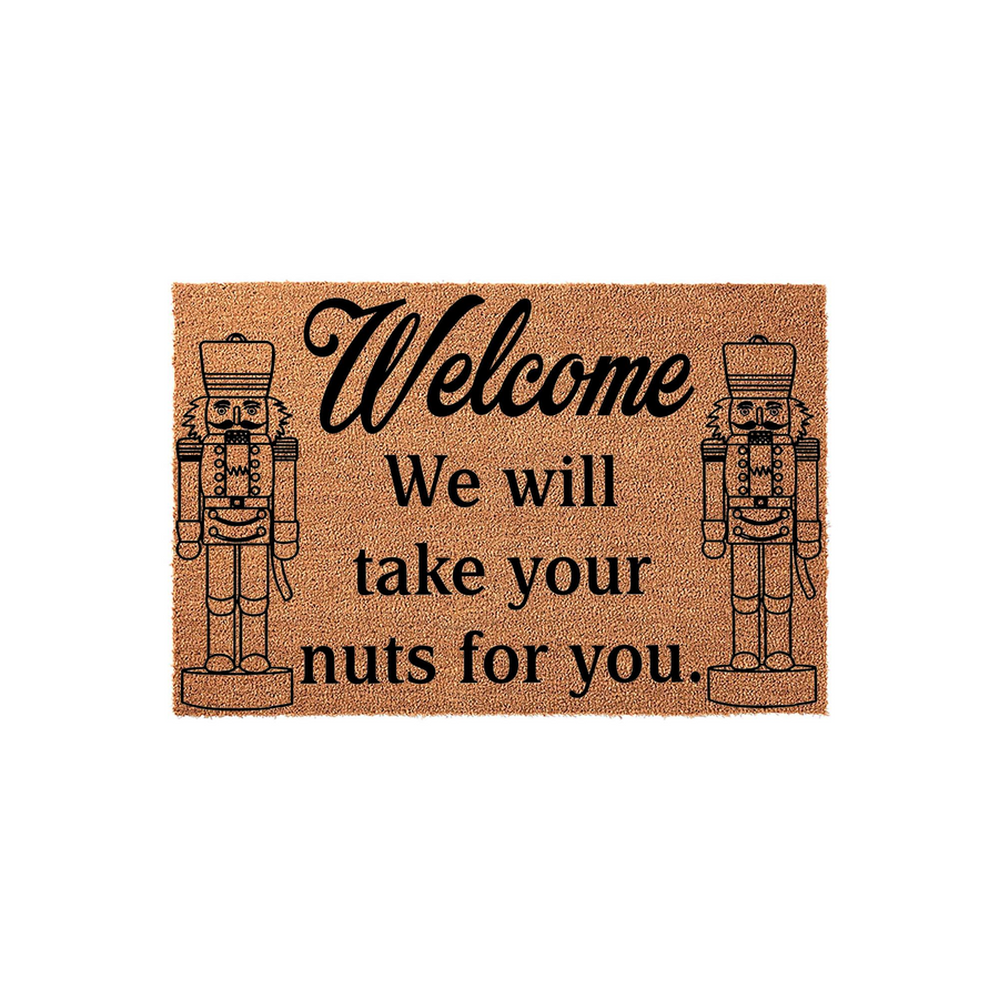 Nutcracker Welcome Doormat featuring a natural coir texture with two black printed nutcracker figures flanking the humorous text that reads Welcome We will take your nuts for you, creating a festive holiday entryway decor piece.