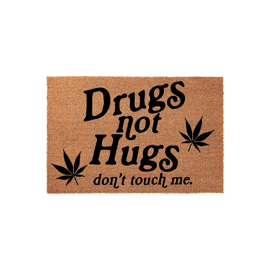 Drugs Not Hugs Doormat featuring a natural coir texture with bold black text and cannabis leaf graphics, creating a humorous and edgy entryway rug that clearly communicates a funny message to all your house guests and visitors.