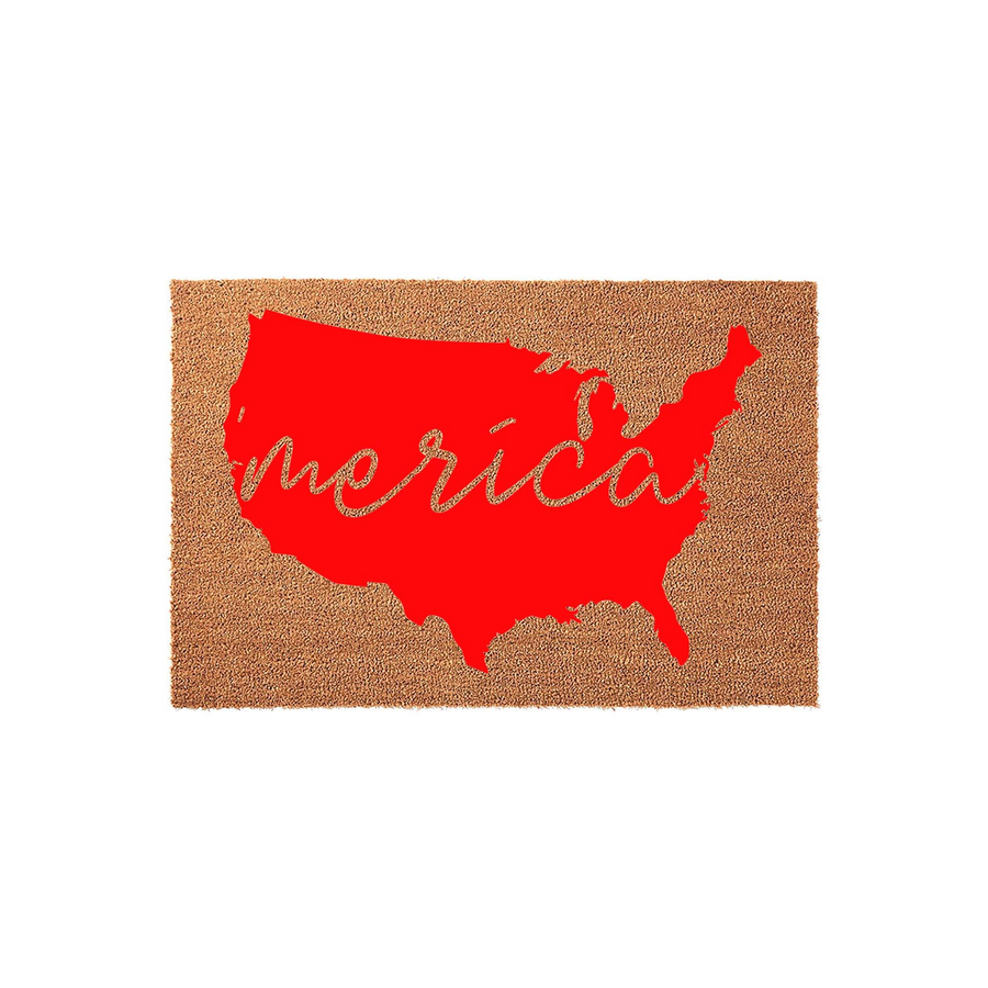 Patriotic USA Map Doormat featuring a bright red silhouette of the United States on a natural coir fiber background with the word merica written in a stylish white cursive script across the center of the map for a festive home
