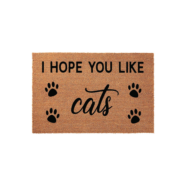 I Hope You Like Cats Coir Doormat featuring a natural tan fiber texture with bold black text and four decorative paw prints, making a fun and welcoming entrance rug for any cat lover's home decor on a plain white studio