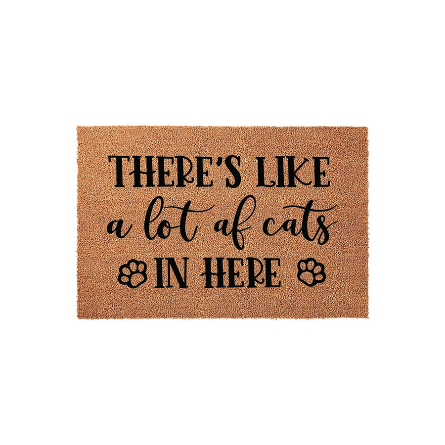 Funny Cat Lover Coir Doormat featuring the text There is like a lot of cats in here with decorative paw prints, set against a plain white background to showcase the natural brown fiber texture of this humorous indoor or outdoor