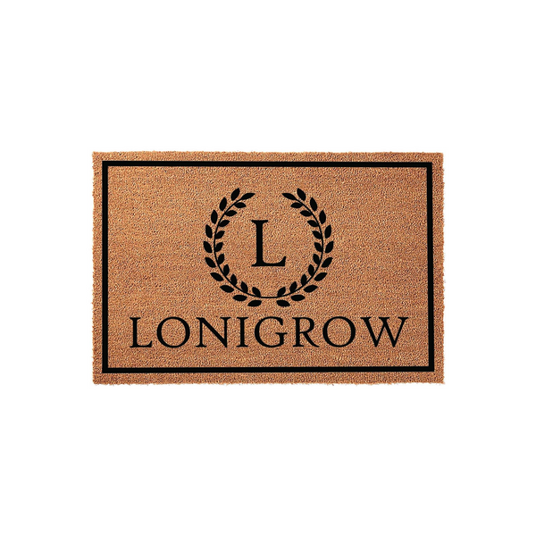 Personalized coir doormat featuring a classic black border, a central laurel wreath monogram with the letter L, and a custom family name printed in bold black lettering against the natural brown textured fiber background.