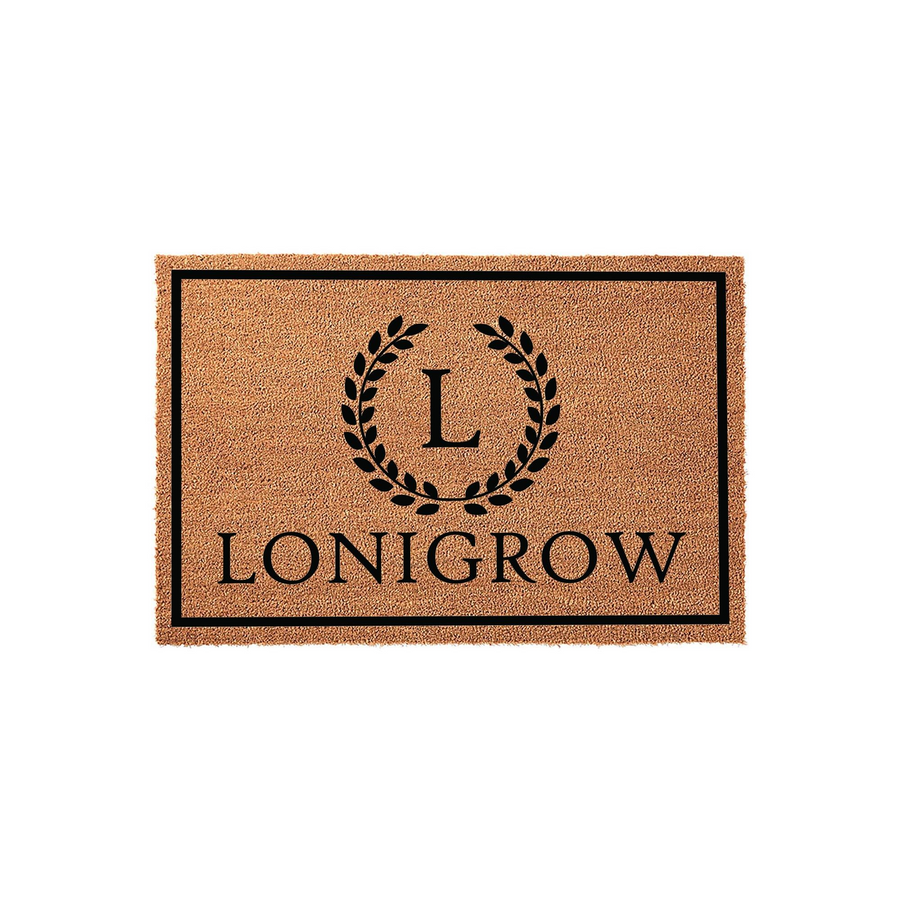 Personalized coir doormat featuring a classic black border, a central laurel wreath monogram with the letter L, and a custom family name printed in bold black lettering against the natural brown textured fiber background.