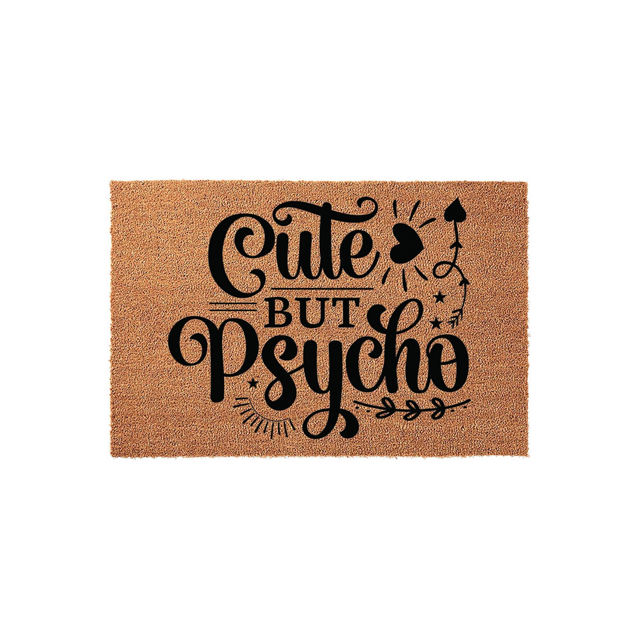 Cute But Psycho coir doormat featuring bold black typography on a natural brown fiber background, designed with whimsical heart and star accents to add a playful touch to your front porch entryway decor for a fun home aesthetic.