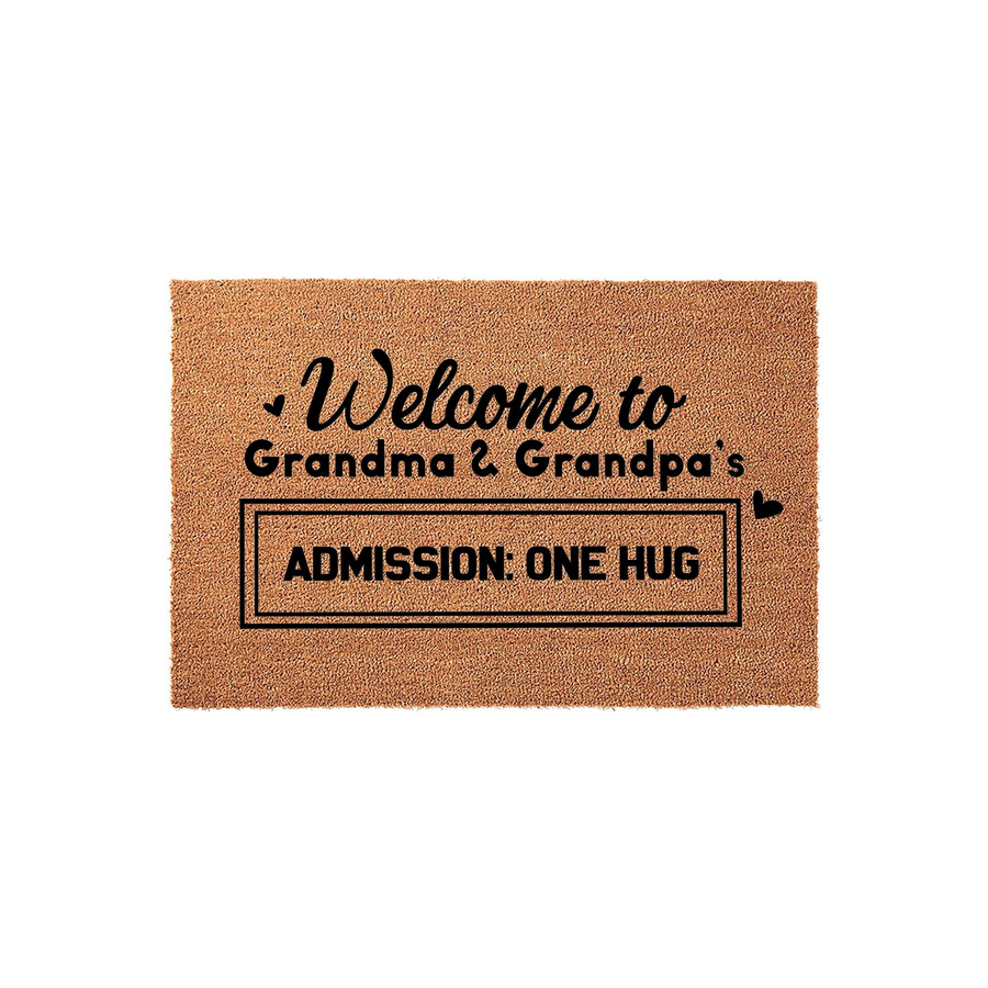 Grandma and Grandpa welcome doormat made of natural coir fiber, featuring black printed text that reads Welcome to Grandma and Grandpa's with the playful instruction Admission: One Hug inside a rectangular border on a plain white