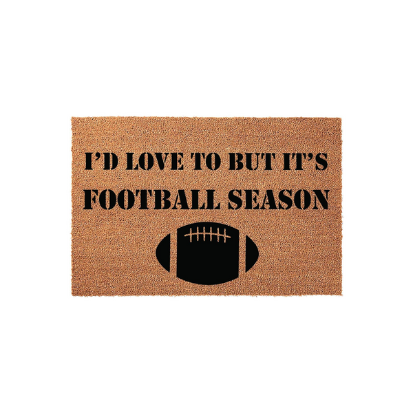 Football Season Coir Doormat featuring the text I'd Love To But It's Football Season in bold black lettering above a graphic of a football, set against a natural brown textured coir background for a fun front porch entrance decor.